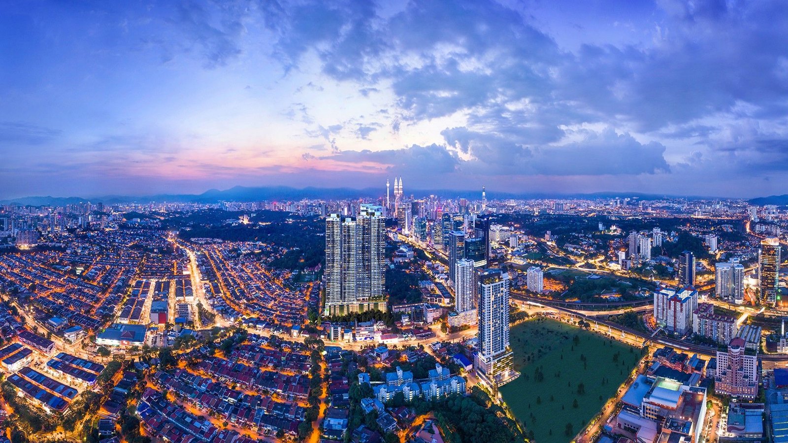 Developer render: aerial view of Bangsar Hill Park at night, looking over Kuala Lumpur