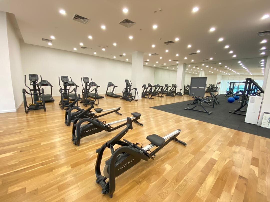 Gymnasium with timber flooring, rowing machines, treadmills and resistance equipment