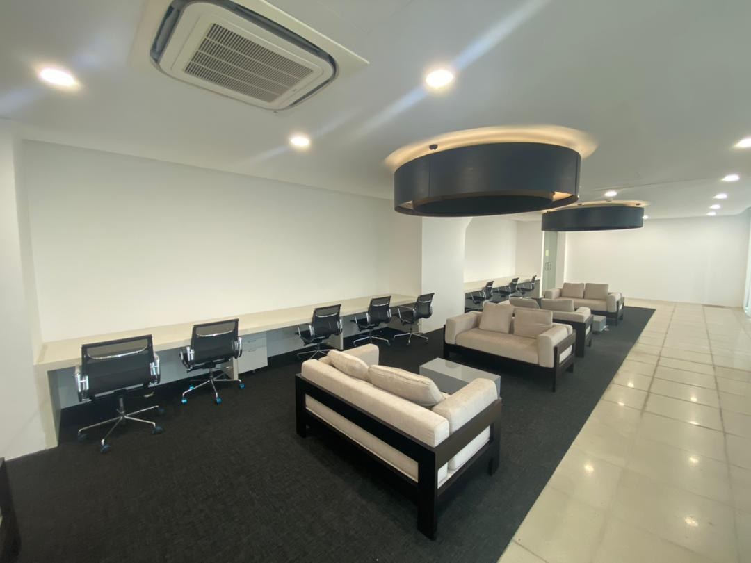 Meeting and co-working room with a boardroom table and seating