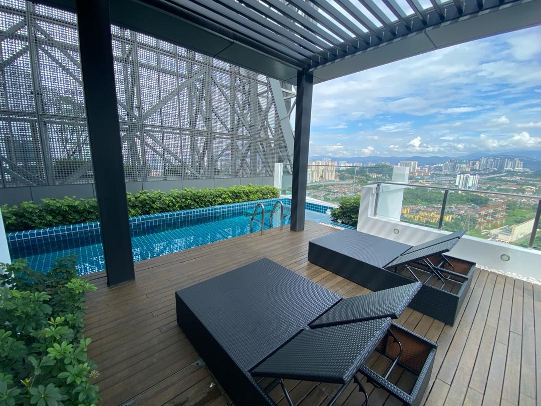 Rooftop pergola deck with loungers and a view across the city