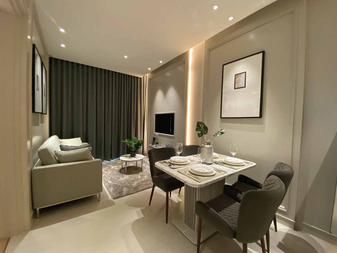 Render of a living and dining area with a dining table and sofa