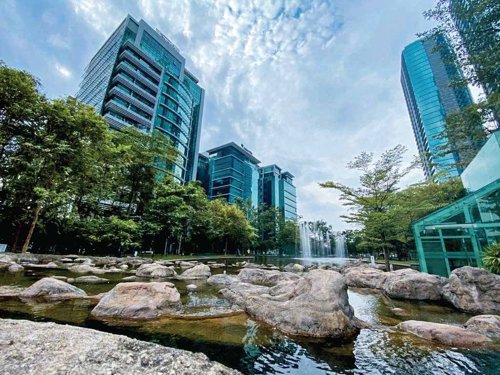 The six-acre park within Bangsar South, with water features and office towers behind