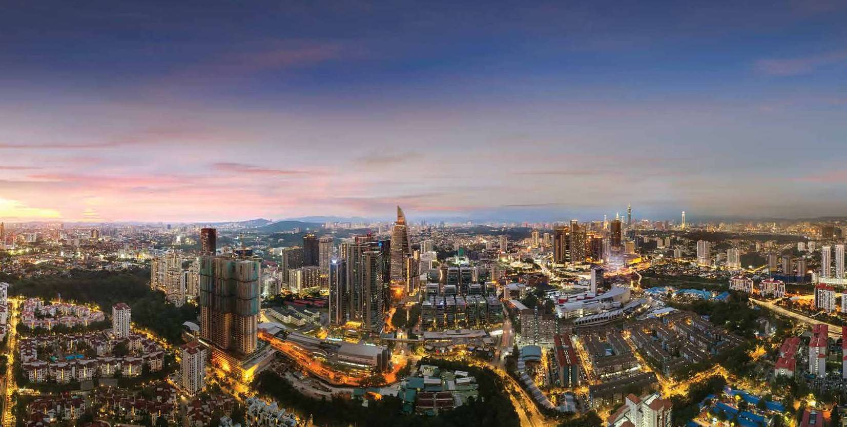 Evening view across the precinct toward the wider Kuala Lumpur skyline